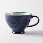 Blue mug with a textured exterior
