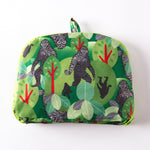 folded pouch featuring a patterned print of sasquatch in the forest 