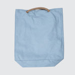 Back view of the bag, laying flat, solid light blue.
