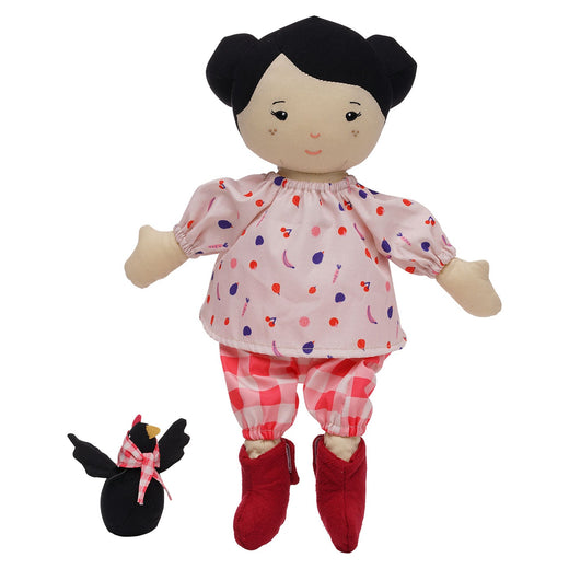 A light-skinned cloth doll with black hair tied in buns with a black chicken next to it. They are wearing matching outfits of pink and red fabric.