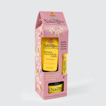 Set of three beauty and personal care items in a pink-coloured box. The items are yellow and arranged in three compartments. The product logo is located on the top of the box, and the front displays the collection name: Vanilla, Rose & Honey Collection.