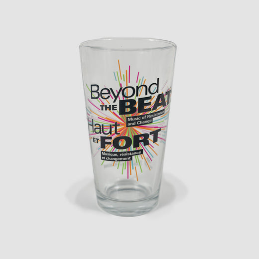 A clear flared glass featuring the “Beyond the Beat” logo in English and French.