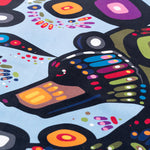Close-up of a tea towel featuring a colourful print depicting a bear.