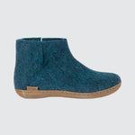 Blue boot with beige sole, side view.