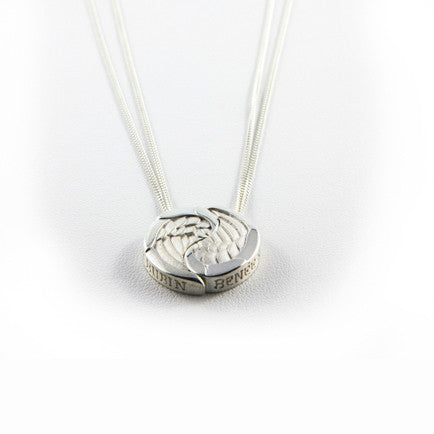 Circular pendant made up of two silver wings; each wing hangs from its own chain