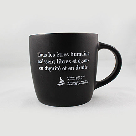 one black mug with white text printed on the exterior
