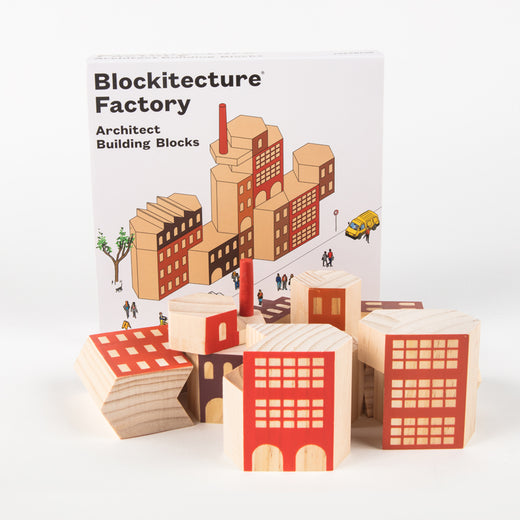 Wooden blocks in front of a box with the text “Blockitecture® Factory Architect Building Blocks”