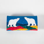 the back of a wallet featuring artwork of two polar bears
