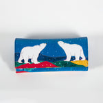 the front of a wallet featuring artwork with two polar bears