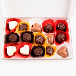 an open box of assorted chocolates 