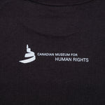 a close-up of image on the back: the Museum icon and the text “Canadian Museum for Human Rights”