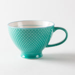 Turquoise mug with a textured exterior