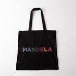 black tote featuring the text “MANDELA” in multi-coloured and multi-patterned capital letters