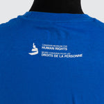 a close-up of image on the back: the Museum icon and the text “Canadian Museum for Human Rights”, and “Musée canadien pour les droits de la personne” 