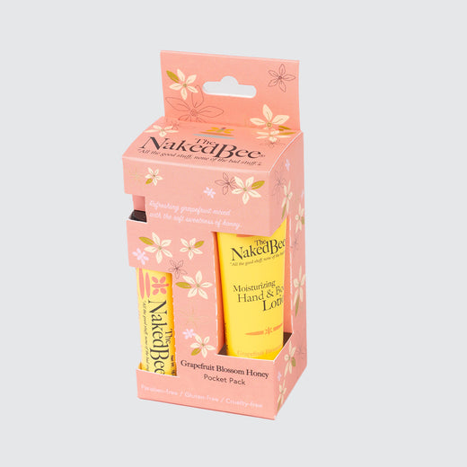 Packaging containing two tubes. The packaging is pink with white flowers and the tubes are yellow.