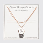 Necklace in the package. Glass House Goods - be unbreakable is displayed.
