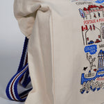 Side view of the tote bag, displaying the squared bottom and shape of bag.