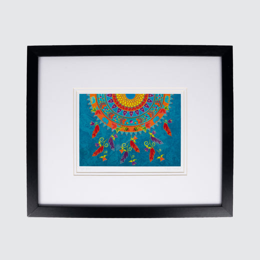 Framed art print showing a brightly coloured half-circle with bear paws and feathers on a blue background.