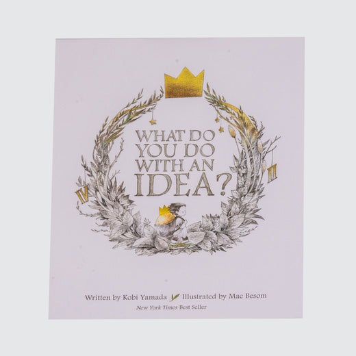 Cover of the box set showing the title in a wreath of decorated leaves with a child at the bottom and a golden crown at the top.