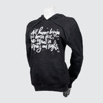 Black sweater with script on a mannequin.